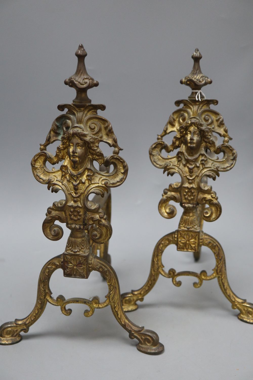 A pair of gilt bronze chenets, height 37cm